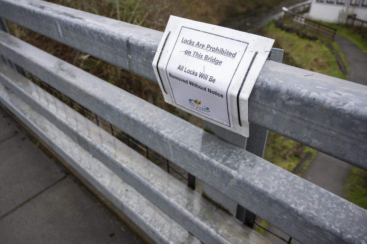 A sign prohibiting locks on a bridge over Donkey Creek is pictured on Wednesday, March 25, 2026, in Gig Harbor.