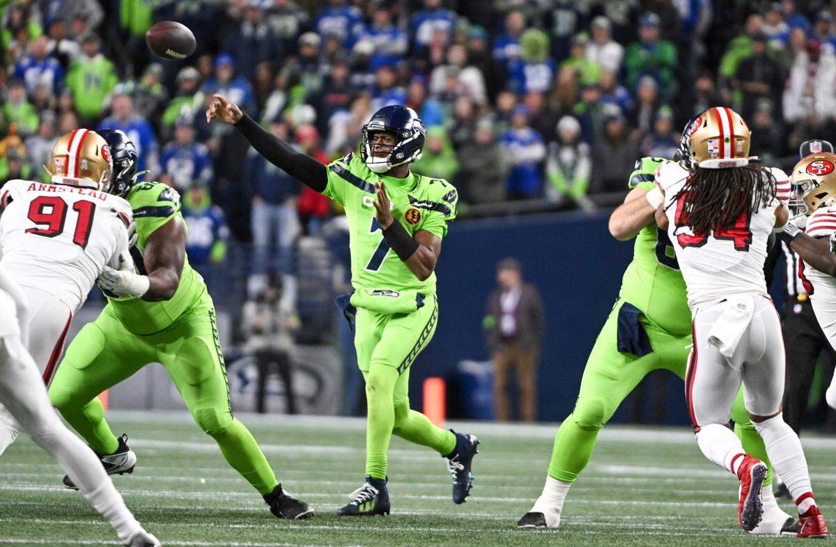 Seattle Seahawks quarterback Geno Smith (7) passes the ball during the first quarter of the game against the San Francisco 49ers at Lumen Field, Thursday, Nov. 23, 2023, in Seattle, Wash.