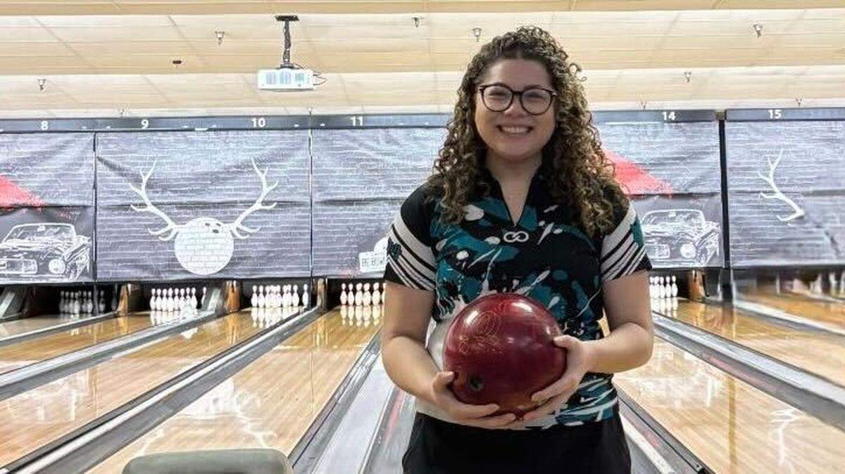 Spanaway Lake’s Tamia Yeager smiles after bowling a perfect 300 game during a high school meet with South Kitsap High School at Paradise Lanes on Dec. 19, 2024 in Tacoma, Wash.