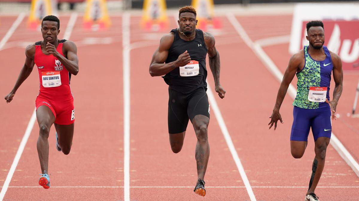 Seattle Seahawks wide receiver DK Metcalf, center, competes in the second heat of the men’s 100-meter dash prelim during the USATF Golden Games at Mt. San Antonio College Sunday, May 9, 2021, in Walnut, Calif. At left is Felipe Bardi Dos Santos and at right is Abdullah Mohammed. (AP Photo/Ashley Landis)