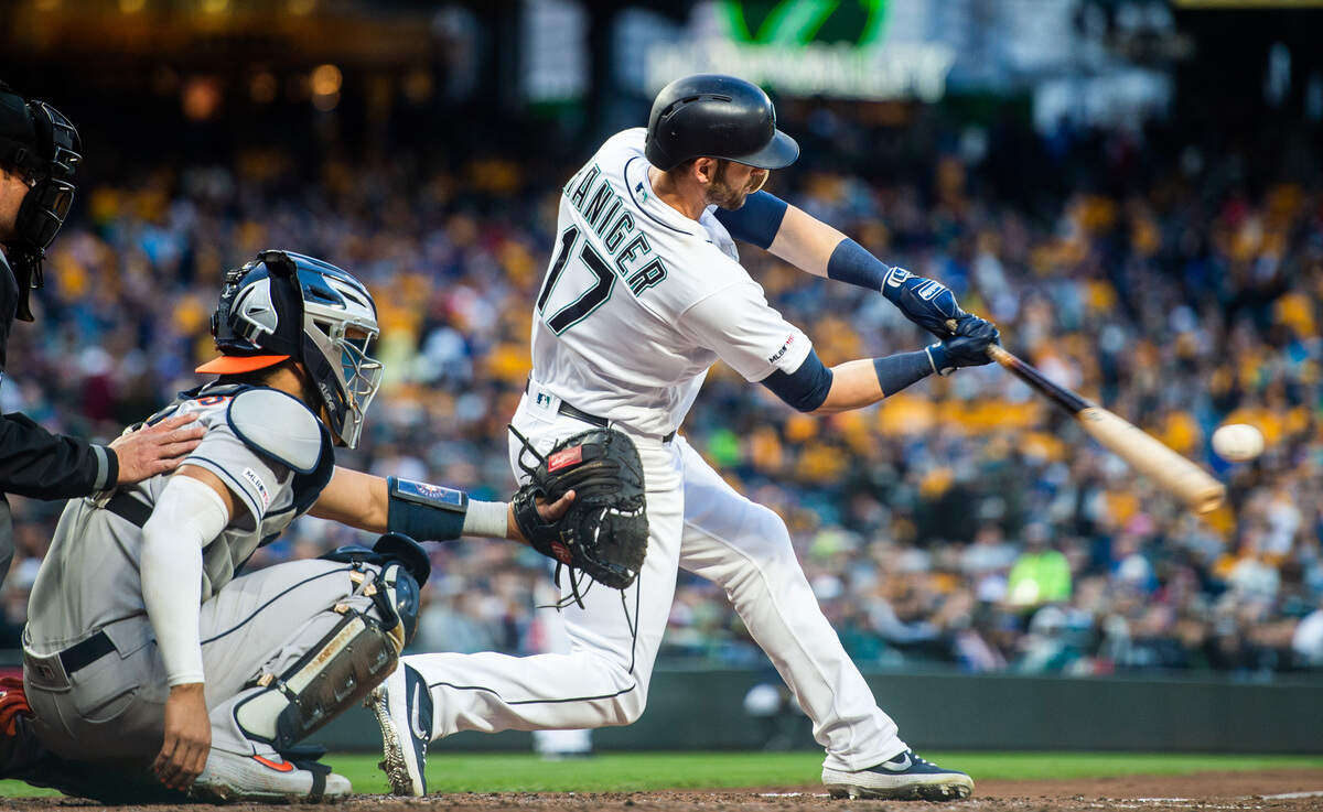 Mariners right fielder Mitch Haniger hits a solo home run in the fourth inning. The Seattle Mariners played the Houston Astros in a Major League Baseball game at T-Mobile Park in Seattle, Wash., on Saturday, April 13, 2019.