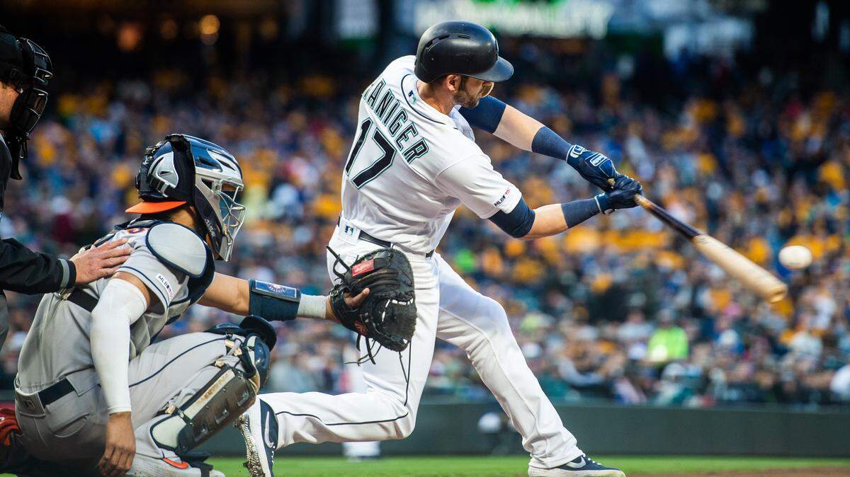 Mariners right fielder Mitch Haniger hits a solo home run in the fourth inning. The Seattle Mariners played the Houston Astros in a Major League Baseball game at T-Mobile Park in Seattle, Wash., on Saturday, April 13, 2019.