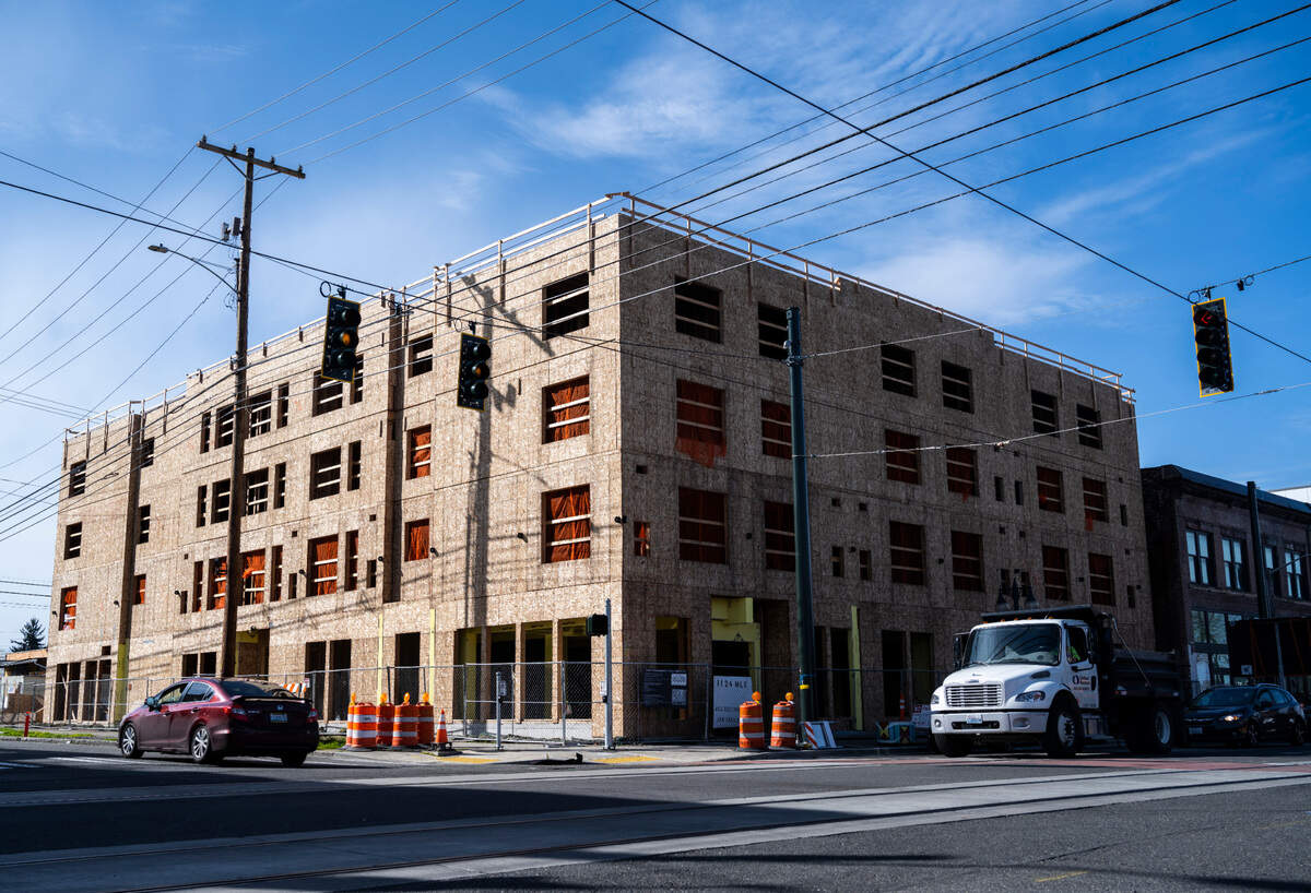 A building is under construction to become affordable housing units for members of the Hilltop community and people of Tacoma at 1124 Martin Luther King Jr. Way on Thursday, March 24, 2022 in Tacoma, Wash.