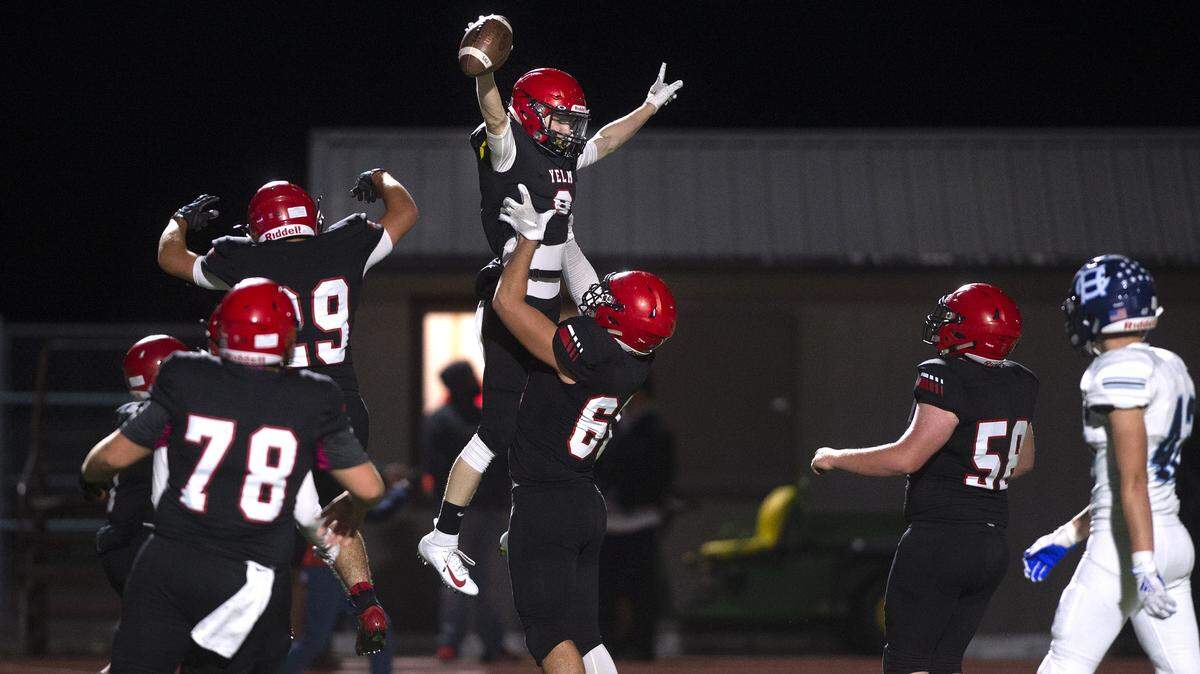 Yelm wide receiver Austin Schaler gets lifted by teammate Bradley McGannon after pulling in a touchdown pass during Friday night’s 3A SSC football game against Gig Harbor at Yelm High School on Sept. 27, 2019.