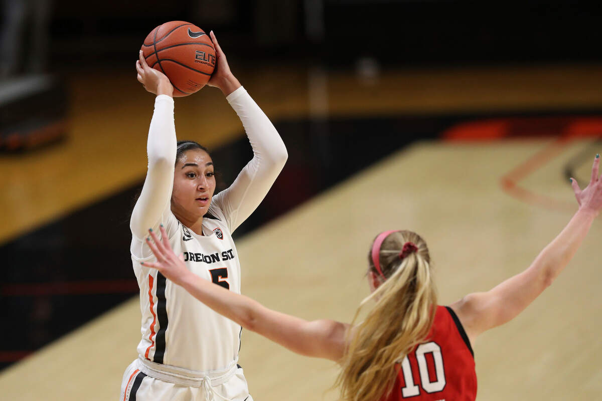 Oregon State’s Taya Corosdale (5) tries to pass away from Utah’s Dru Gylten (10) during an NCAA basketball game on Tuesday, Dec. 8, 2020, in Corvallis, Ore. (AP Photo/Amanda Loman)