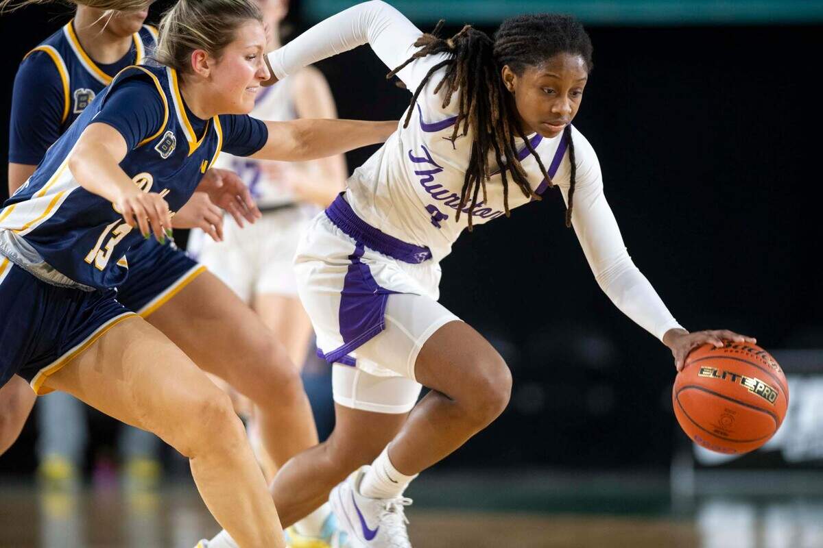 North Thurston guard Soraya Ogaldez (3) dribbles past Bellevue’s Athena LaBow (13) during the first half of a Class 3A state basketball tournament first-round game at the Tacoma Dome on Thursday, March 6, 2025, in Tacoma, Wash.