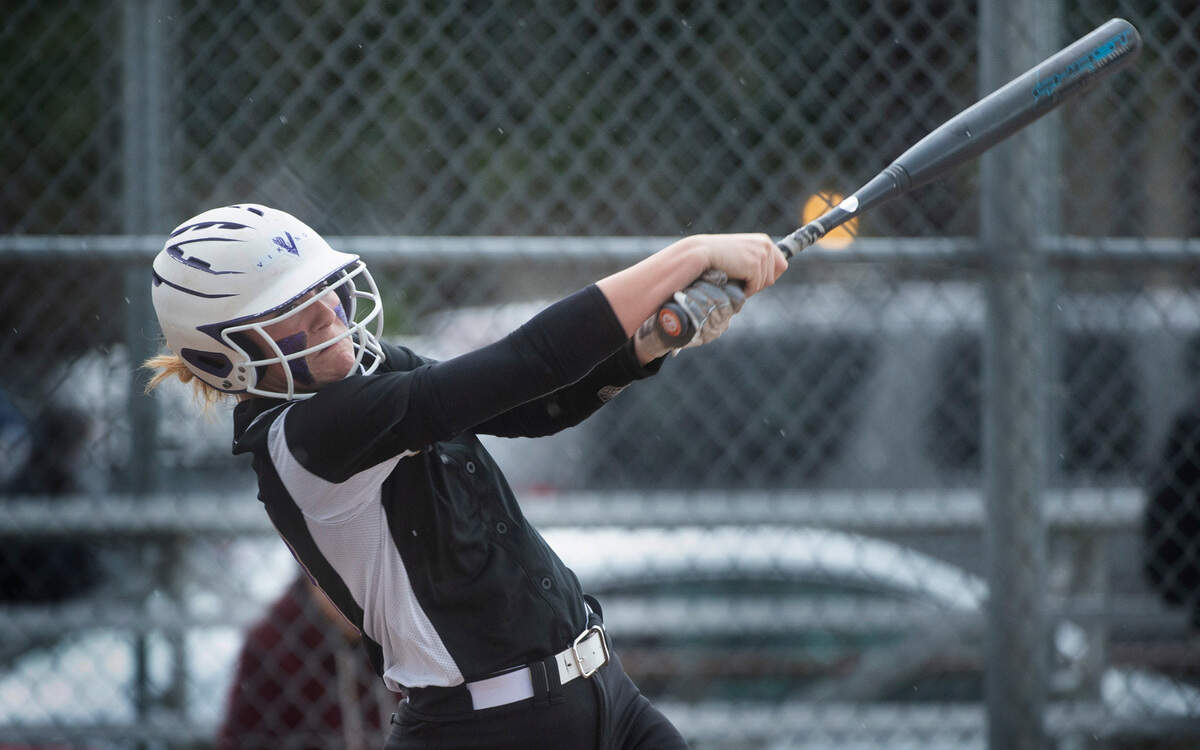 Puyallup’s Sam Bland connects for a two-run home run during the Vikings’ fastpitch game against the Sumner Spartans at Puyallup High School in Puyallup, Washington, on Wednesday, April 27, 2022.