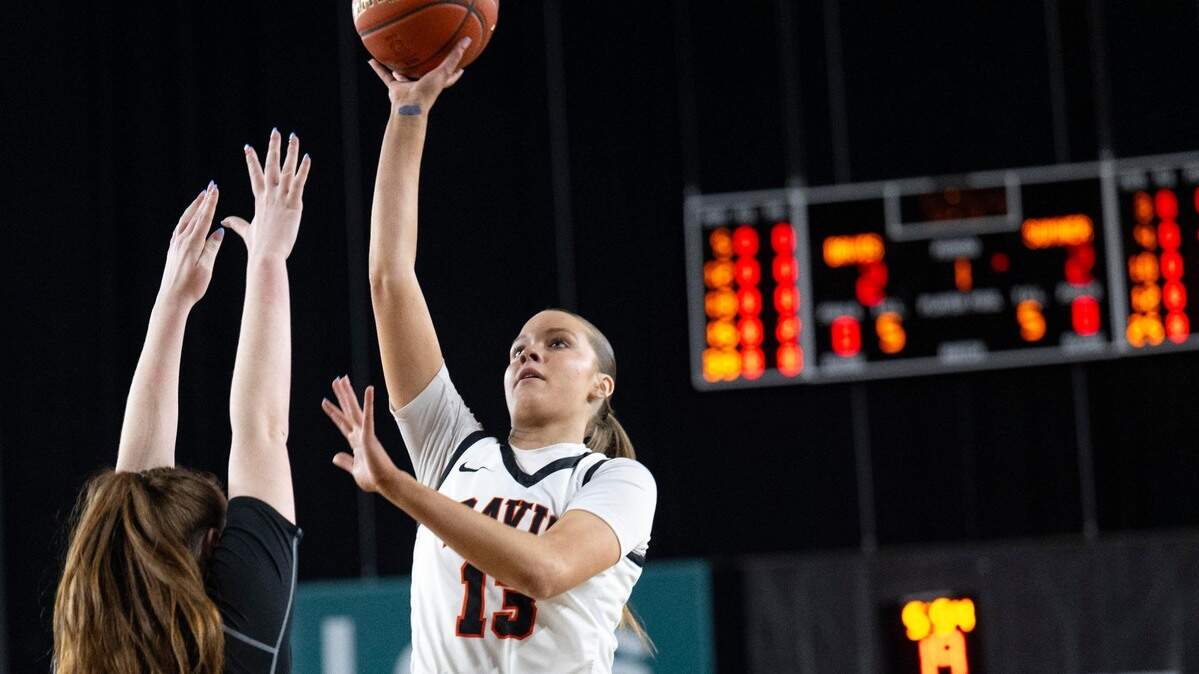 Davis guard Cheyenne Hull (13) attempts a shot over Sumner forward Parker Gould (25) during the first quarter of the Class 4A state championship game at the Tacoma Dome on Saturday, March 8, 2025, in Tacoma, Wash.