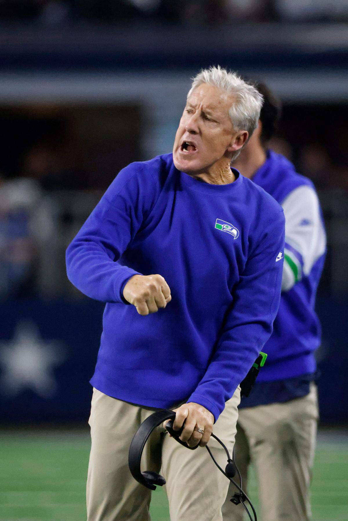 Seattle Seahawks head coach Pete Carroll celebrates a defensive stop in the first half of an NFL football game against the Dallas Cowboys in Arlington, Texas, Thursday, Nov. 30, 2023. (AP Photo/Michael Ainsworth)