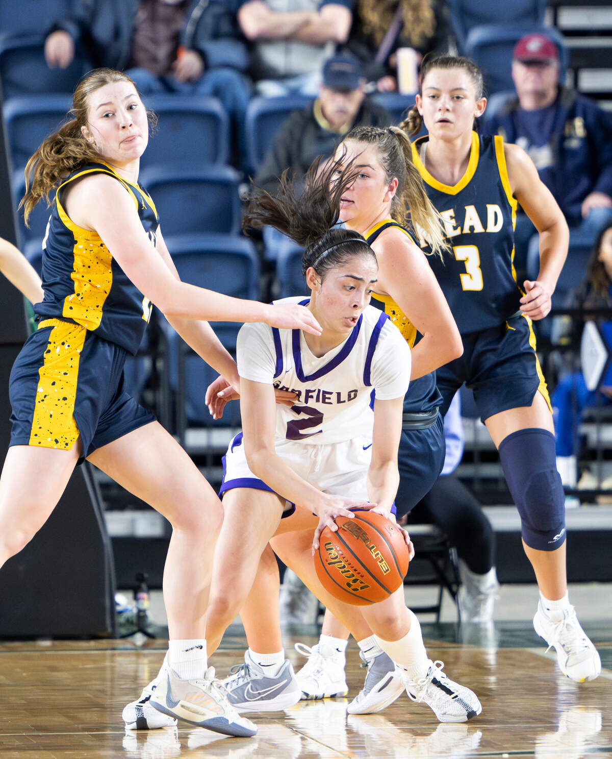 Garfield’s Katie Fiso (2) struggles as Mead Panthers doubles up on here in the closing seconds of the first half of the Class 3A state championship game at the Tacoma Dome, on Saturday, March 2, 2024, in Tacoma, Wash.