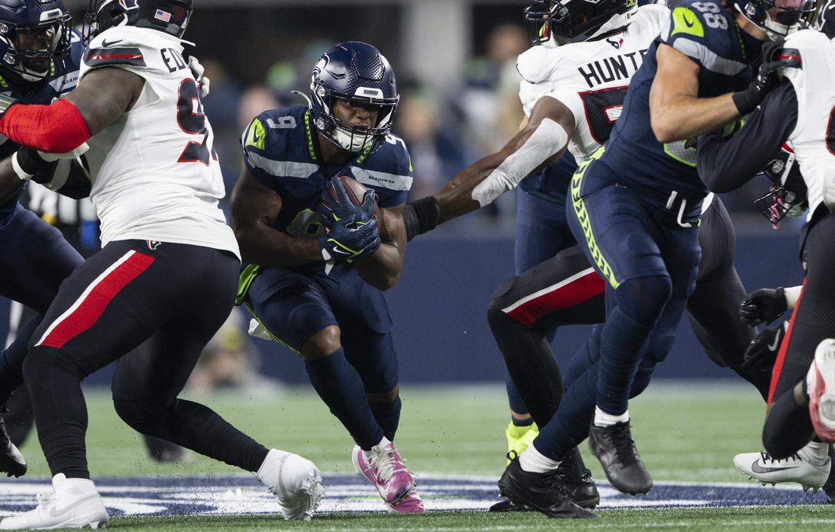 Seattle Seahawks running back Kenneth Walker III (9) carries the ball during the first quarter of the game against the Houston Texans at Lumen Field, on Monday, Oct. 20, 2025, in Seattle.