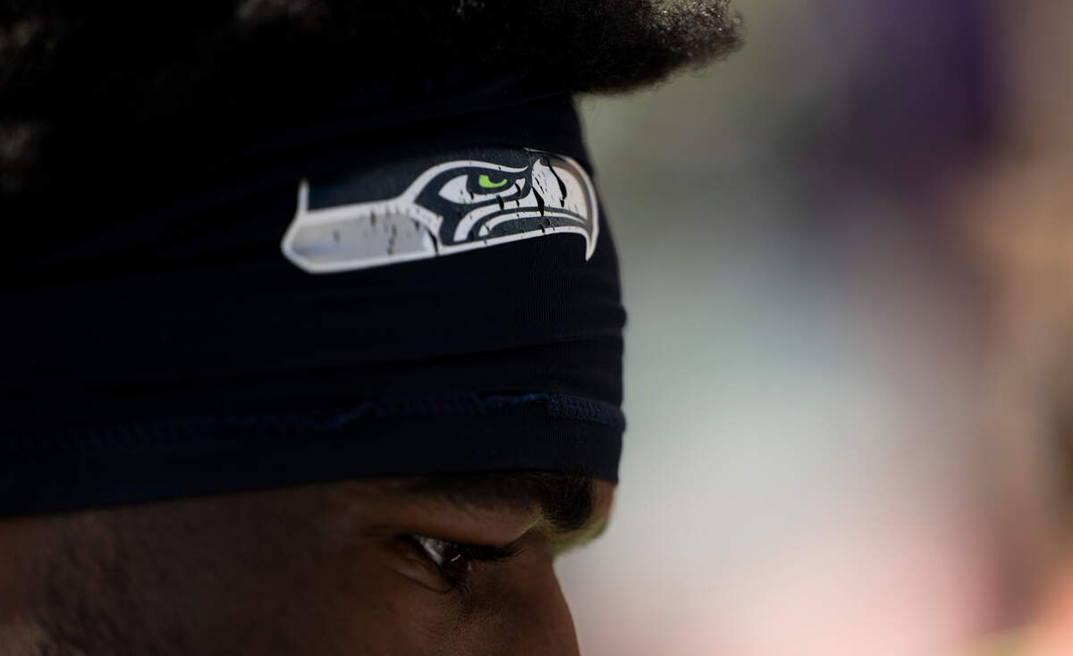 Seattle Seahawks safety Nick Emmanwori (3) signs autographs after training camp at Virginia Mason Athletic Center on Friday, July 25, 2025, in Renton, Wash.