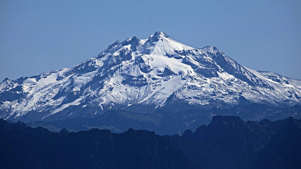 This Sept. 4, 2014, photo shows Glacier Peak, in Everett, Wash.  The U.S. Geological Survey has decided to keep a closer eye on the slumbering giant in Snohomish County’s wild, scenic back yard. A new study is underway for Glacier Peak, one of the most dangerous but least monitored volcanoes in the country.