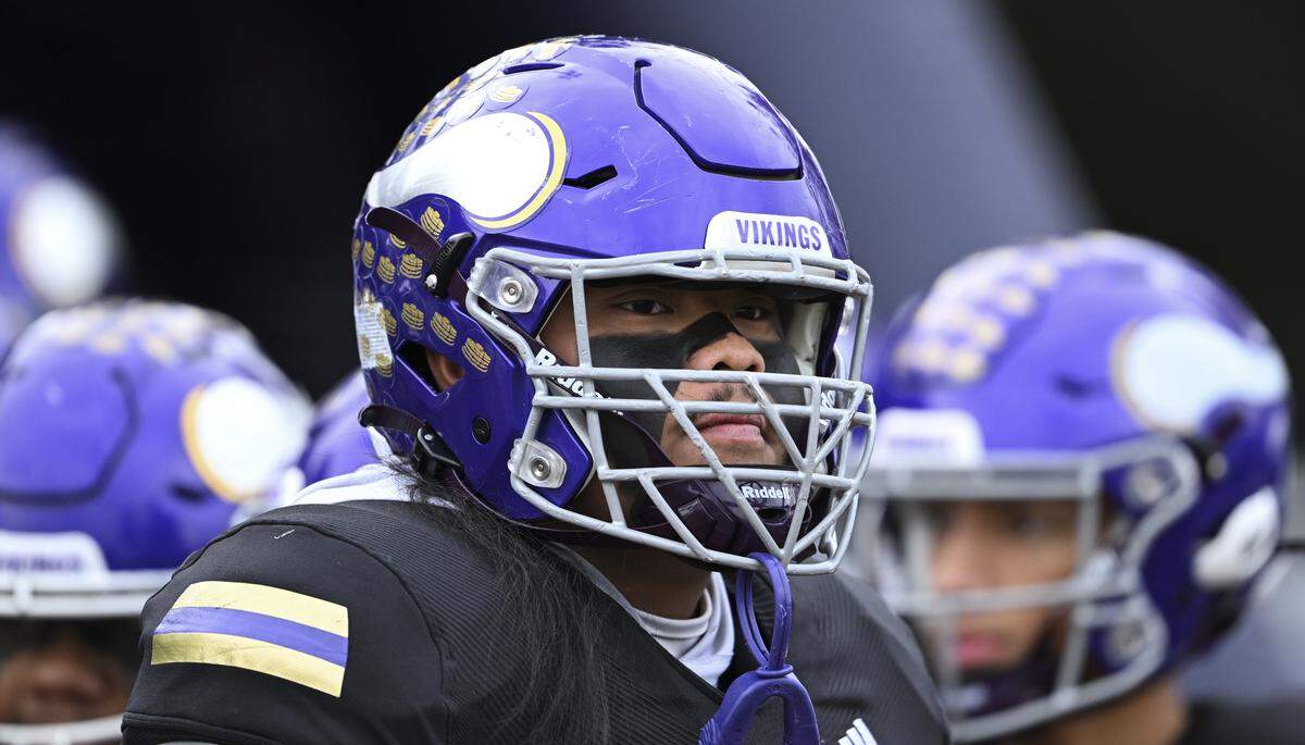 Puyallup lineman Ah Deong Yang (77) looks on before 4A state semifinal game against Sumner at Sparks Stadium, on Saturday, Nov. 29, 2025 in Puyallup, Wash.