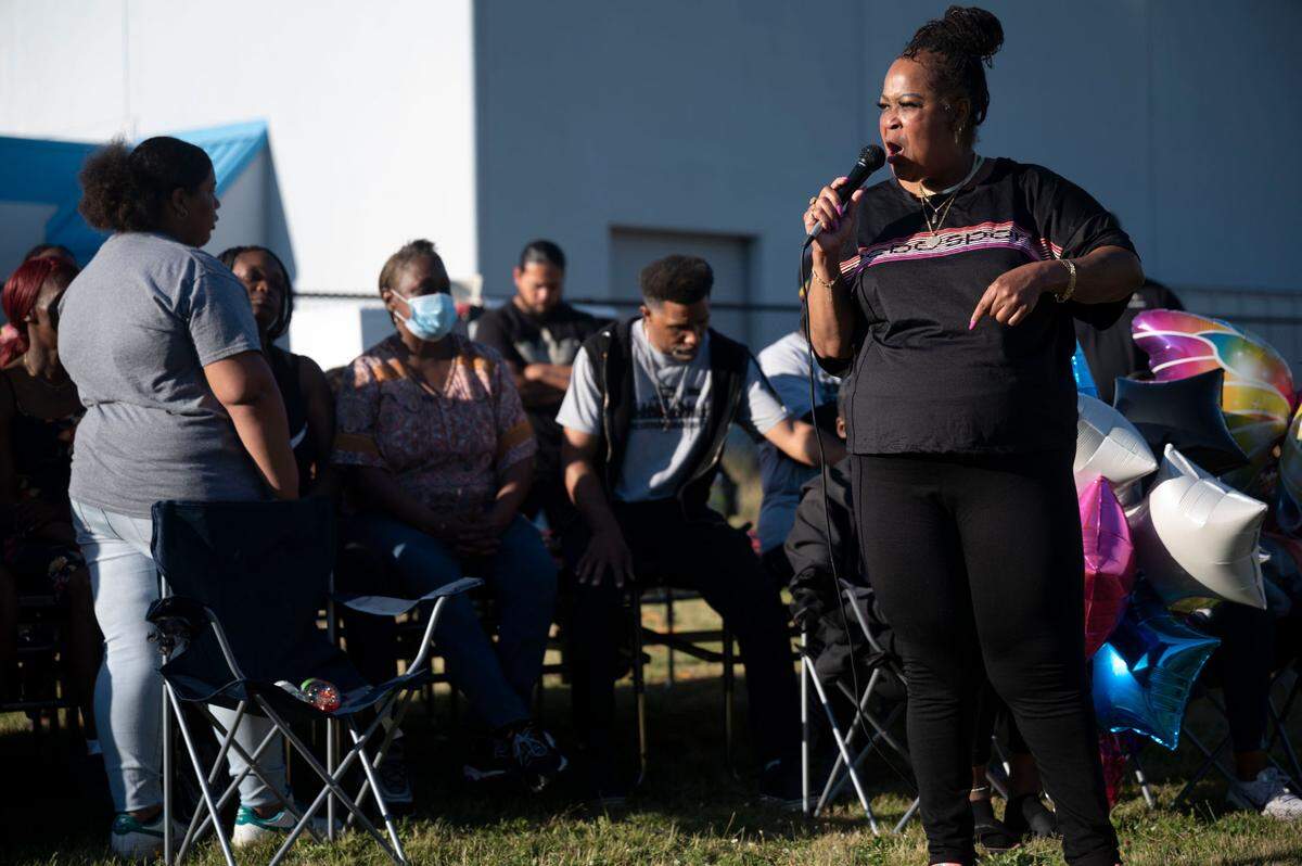 Candace Wesley speaks to people gathered at Stanley Playfield mourning the death of 14-year-old Iyana Ussery on Thursday, July 7, 2022, in Tacoma, Wash. Iyana Ussery was killed in a shooting on Wednesday, July 6, 2022.