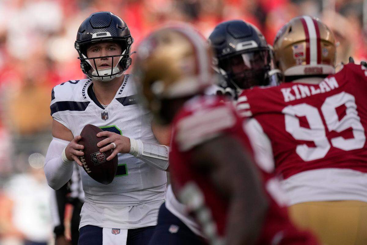 Seattle Seahawks quarterback Drew Lock looks to pass during the first half of an NFL football game against the San Francisco 49ers in Santa Clara, Calif., Sunday, Dec. 10, 2023. (AP Photo/Godofredo A. Vásquez)