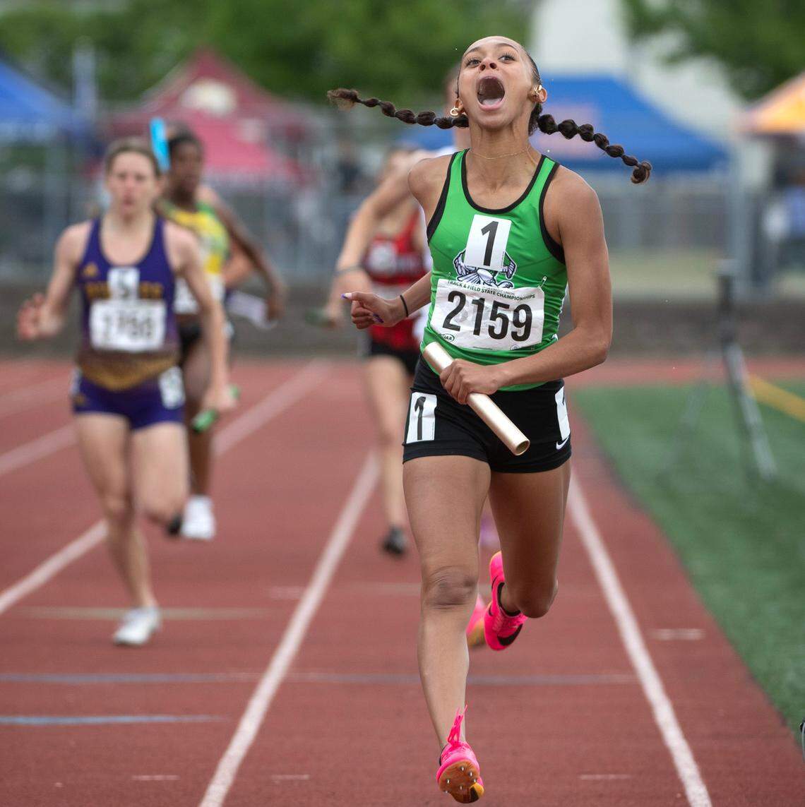 Tumwater’s Ava Jones erupts in joy as she crosses the finish line to give the T-Birds the state title in the 2A girls 4x200 relay during the final day of the WIAA state track and field championships at Mount Tahoma High School in Tacoma, Washington, on Friday, May 26, 2023.