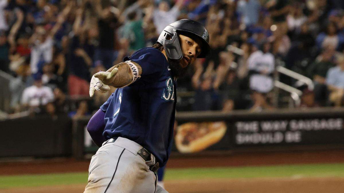 Seattle Mariners’ JP Crawford celebrates as he rounds the bases after hitting a home run during the ninth inning of a baseball game against the New York Mets, Saturday, Sept. 2, 2023, in New York. (AP Photo/Jason DeCrow)
