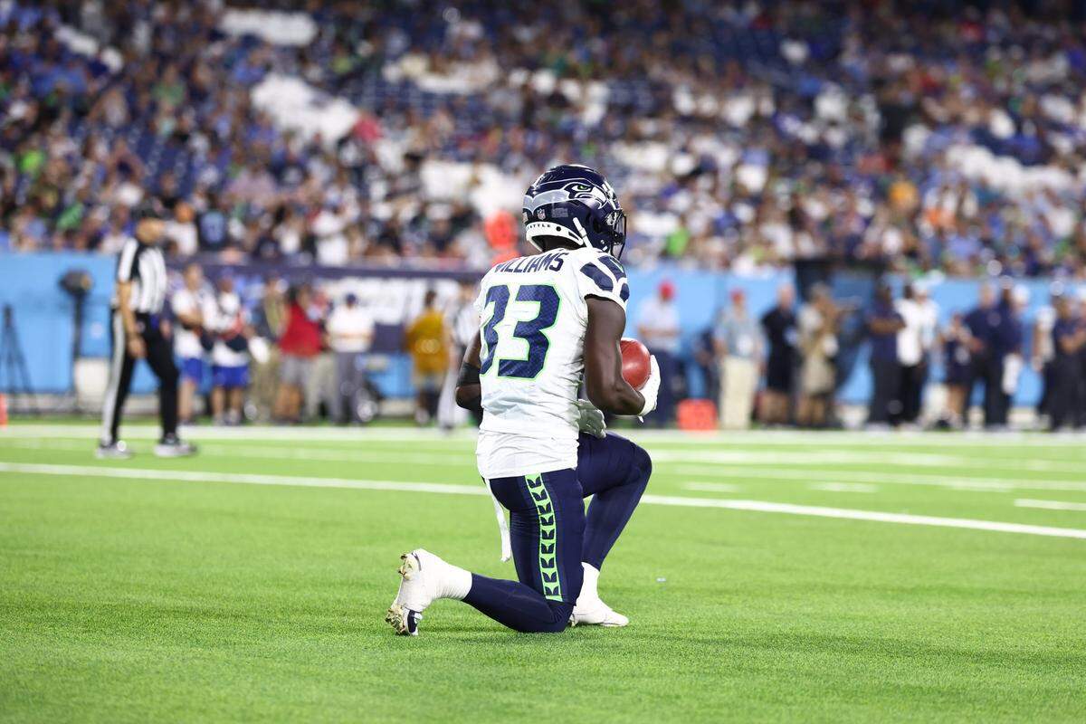 Aug 17, 2024; Nashville, Tennessee, USA; Seattle Seahawks wide receiver Dee Williams (33) catches a kickoff in the end zone in the fourth quarter against the Tennessee Titans at Nissan Stadium. Mandatory Credit: Casey Gower-USA TODAY Sports