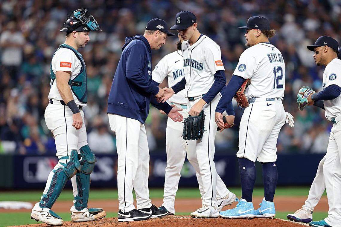SEATTLE, WASHINGTON - OCTOBER 15: Manager Dan Wilson of the Seattle Mariners relieves George Kirby #68 during the fifth inning against the Toronto Blue Jays in game three of the American League Championship Series at T-Mobile Park on October 15, 2025 in Seattle, Washington. (Photo by Steph Chambers/Getty Images)