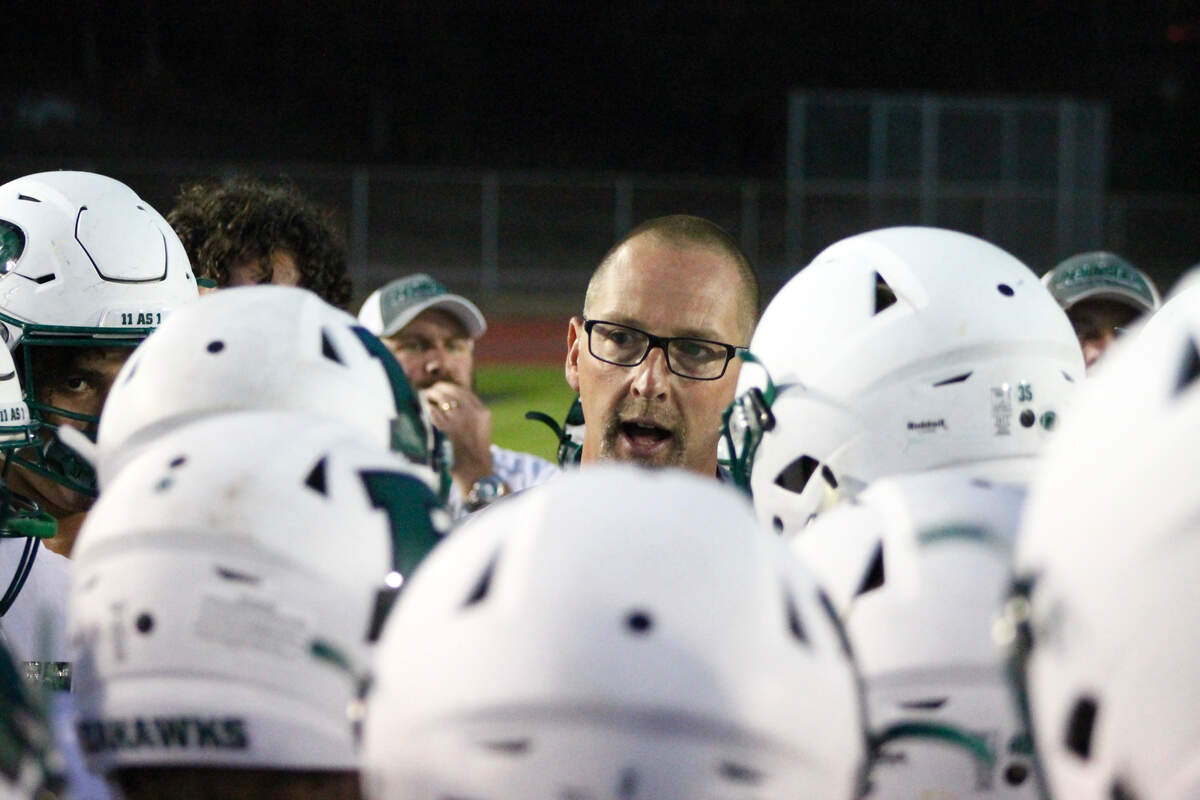 Peninsula coach Ross Filkins addresses his team in their game against O’Dea at West Seattle Stadium on Friday, Aug. 31. O’Dea won the season opener, 28-0.
