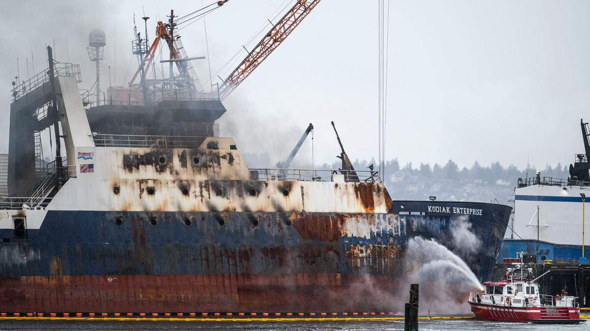 Tacoma fire crews work to put out a fire that broke out Saturday on the fishing vessel Kodiak Enterprise, while it was docked in Hylebos Waterway in the Port of Tacoma in Tacoma, Wash. on April 10, 2023.
