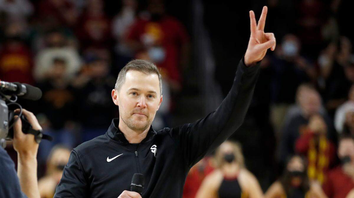 Southern California head football coach Lincoln Riley is introduced to the basketball fans during the first half of an NCAA college basketball game against Long Beach State in Los Angeles, Sunday, Dec. 12, 2021. (AP Photo/Alex Gallardo)