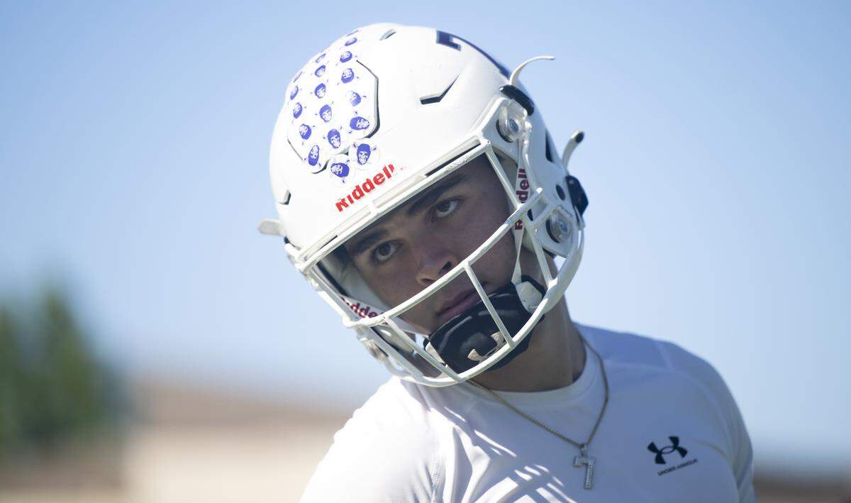 Sumner quarterback Nate Donovan runs drills during a football practice at Sumner High School on Friday, Aug. 22, 2025, in Sumner, Wash.