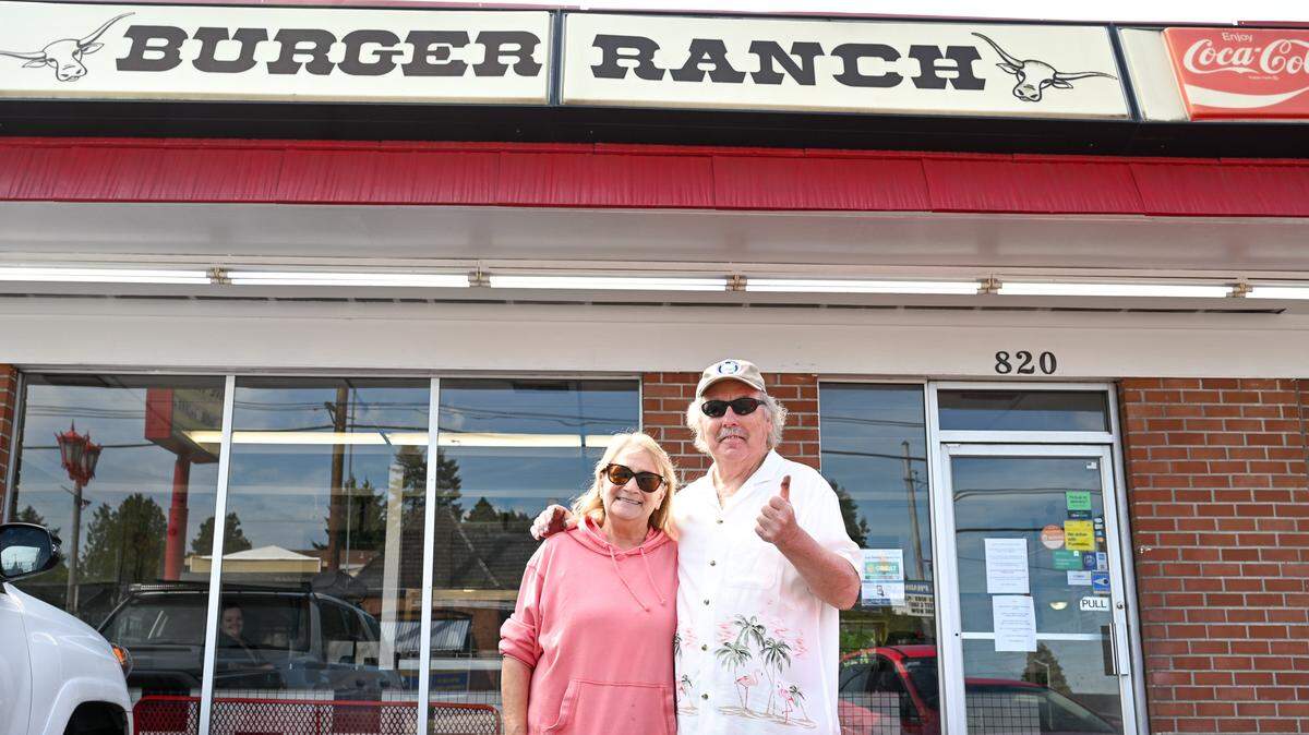 Deborah and Terry Howells, owners of Burger Ranch, pose outside their business on Monday, Aug. 19, 2024 in Tacoma. Burger Ranch officially closed on Thursday, Aug. 15, 2024.