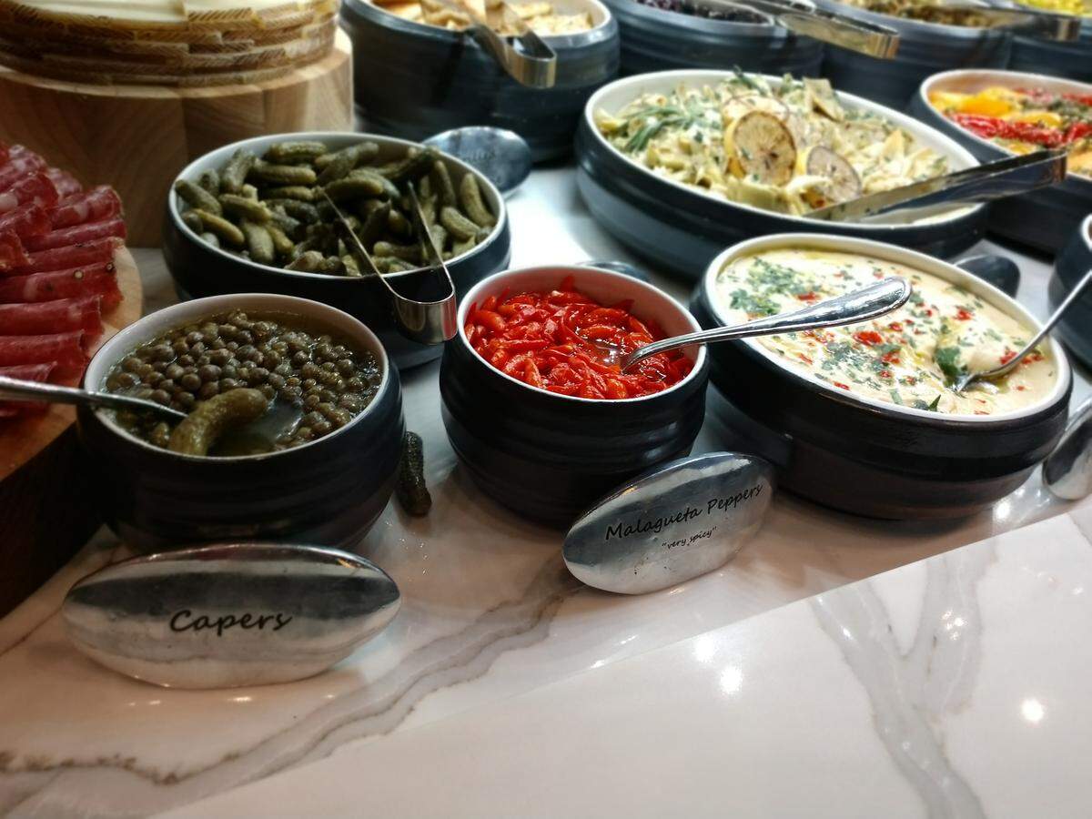 An assortment of pickles and other accompaniments on the cold bar at Tacoma’s Texas de Brazil.