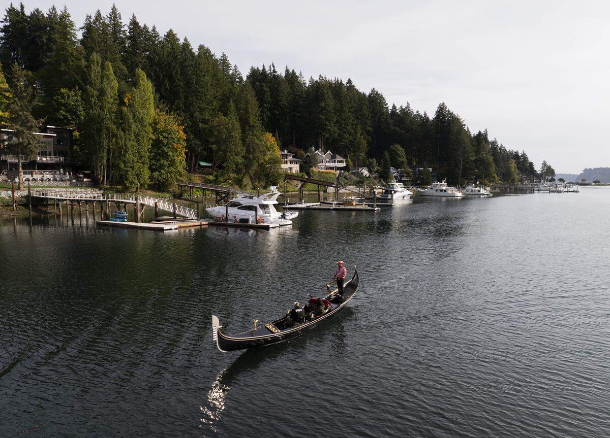 John Synco, owner of Gig Harbor Gondola rows his Venetian gondola, on Thursday, Oct. 9, 2025, in Gig Harbor, Wash. Synco just celebrated 10 years running the one-man gondola tour operation that he describes as a passion.