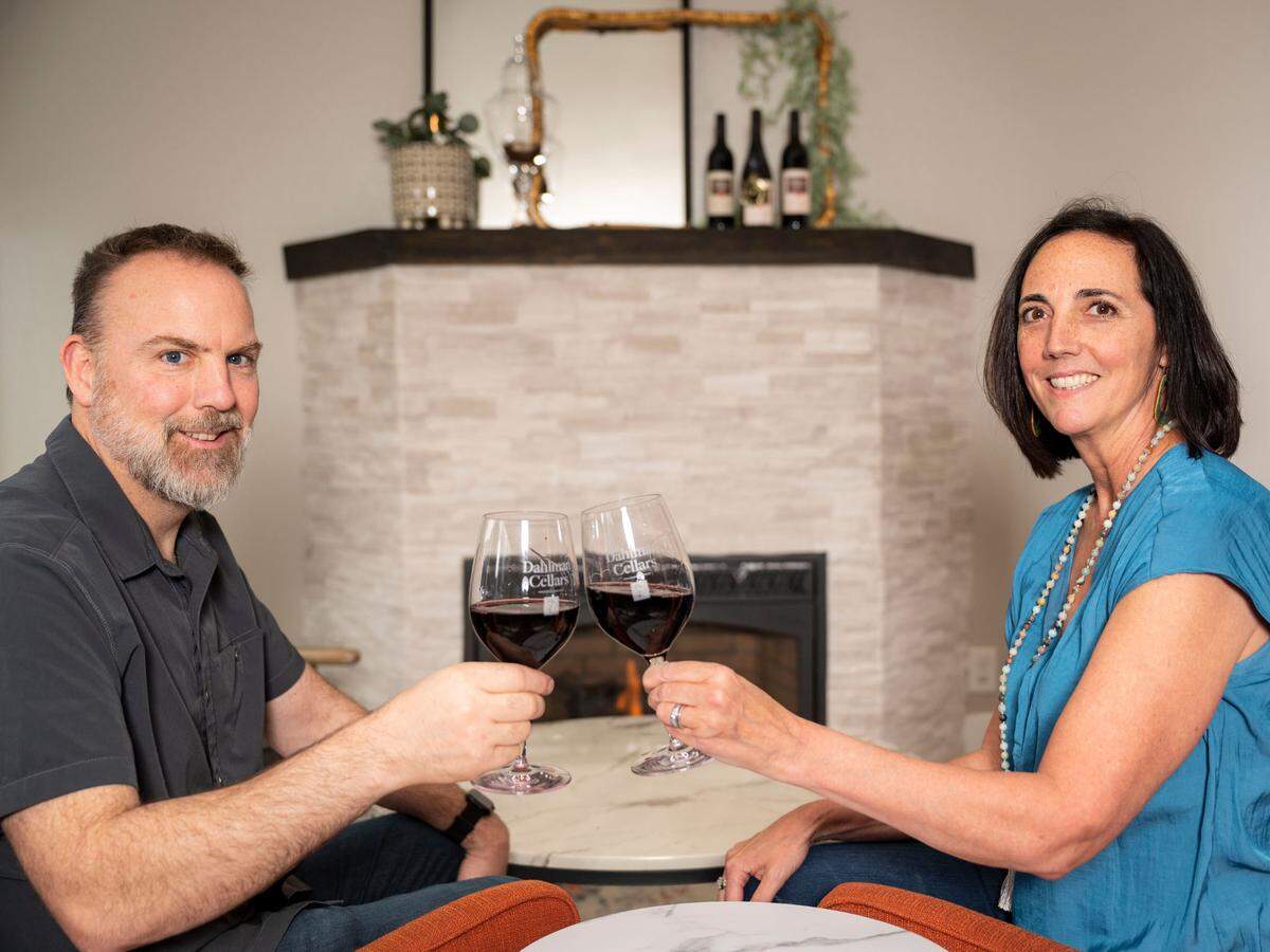 Jim and Andrea Dahlman cheers to the opening of the first Dahlman Cellars tasting room, which offers a living room feel.