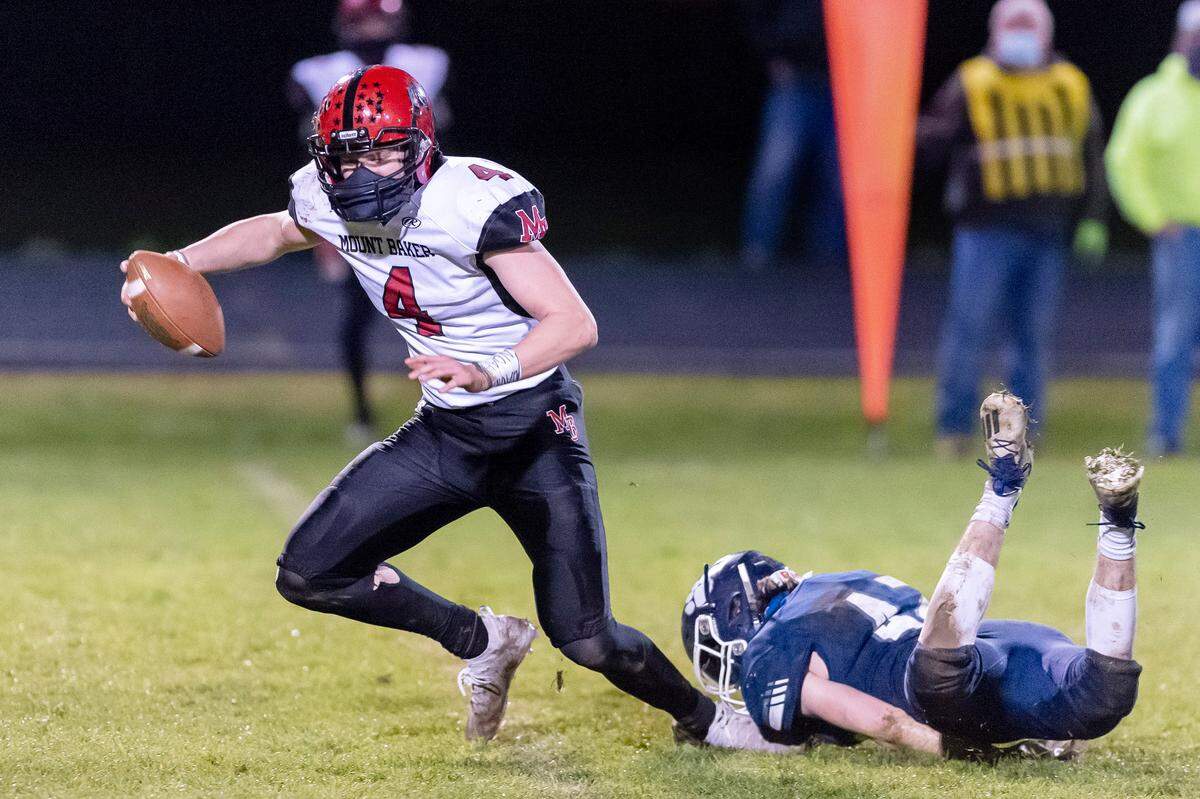 Lynden Christian defensive man Cody Bajema (42) sacks Mount Baker quarterback Mason Jacoby (5) for a 5 yard loss during the 3rd quarter on Saturday evening March 20, at Lynden Christian Lyncs. Lynden Christian defeated Mount Baker 33 to 14.