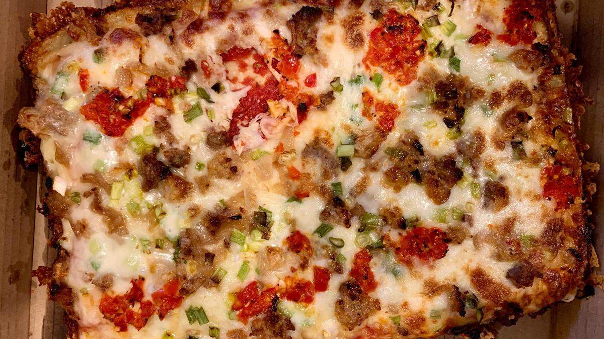 The Detroit-style square pizzas from Tacoma Pie are built to be crisped in the oven at home. The new takeout-only pizzeria operates out of The Gourmet Niche in Tacoma’s West End.