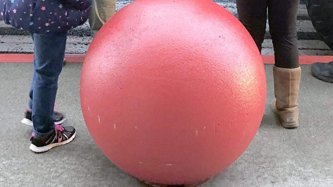 A concrete ball like this one shown in 2018 in front of the Tacoma Target store was knocked off its steel post and injured a woman.