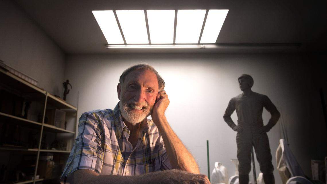 Sculptor Larry Anderson reflects in his Bonney Lake studio with his last sculpture that was made for Aberdeen High School on Tuesday, August 26, 2014.