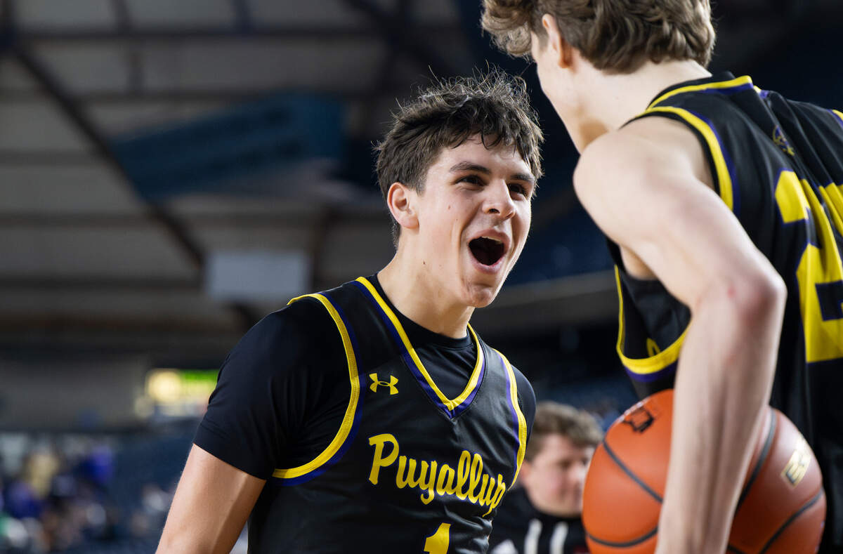 Puyallup’s Lawson Looker (1) and Will Nasinec (25) celebrate their 55-47 victory against Mount Si inf a Class 4A state basketball tournament quarterfinal game at the Tacoma Dome on Thursday, March 6, 2025, in Tacoma, Wash.