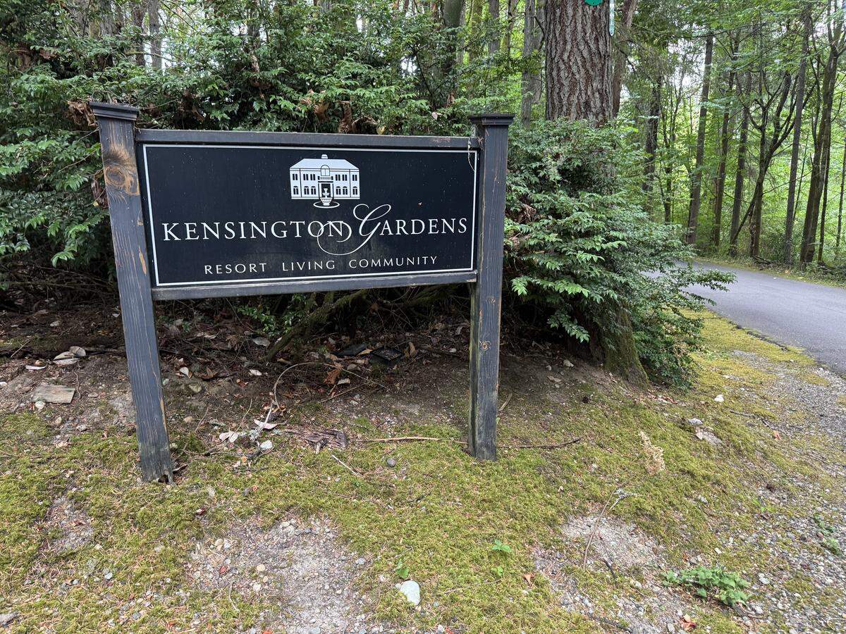A sign for Kensington Gardens next to the driveway off of Olson Drive Northwest, Thursday, Aug. 14, 2025 in the area of Gig Harbor, Wash.