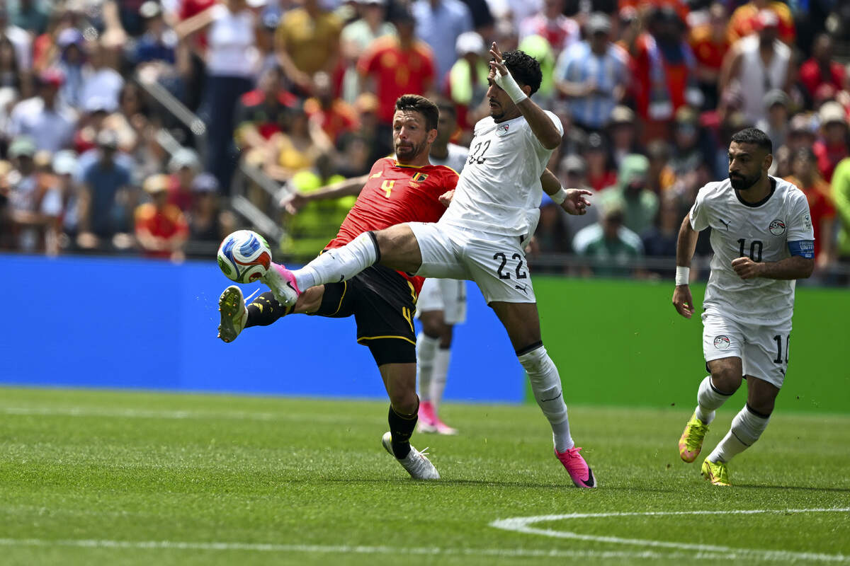 Belgium defender Brandon Mechele (4) and Egypt forward Omar Marmoush (22) fight for control of the ball on Monday, June 15, 2026, during a FIFA World Cup game in Seattle, Wash.