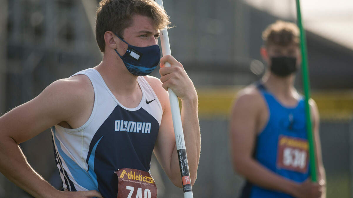 Olympia High School senior Jack Olsen (left) and Gig Harbor senior Jake Jennings wait to throw the javelin at the Class 4A South Puget Sound League track and field championships on Thursday, April 29, 2021 at Sunset Chev Stadium in Sumner, Wash.