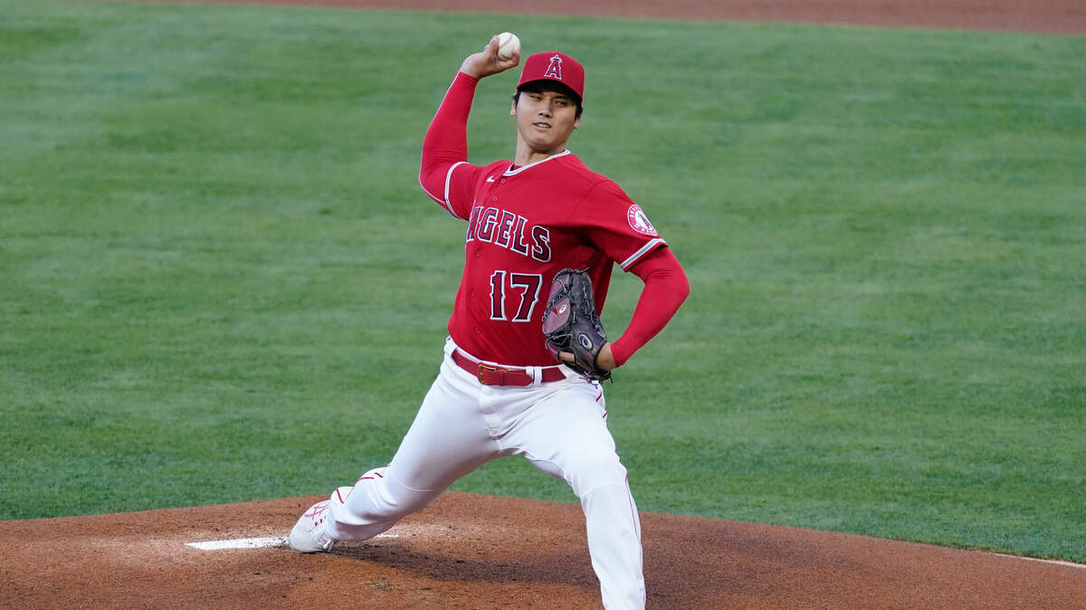 Los Angeles Angels starting pitcher Shohei Ohtani (17) throws during the first inning of a baseball game against the Seattle Mariners Friday, June 4, 2021, in Anaheim, Calif. (AP Photo/Ashley Landis)