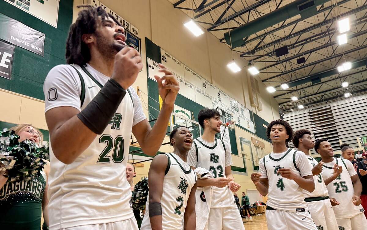 Emerald Ridge High School basketball players celebrate after beating Bonney Lake, 69-54, in a game at Emerald Ridge High School on Thursday, Jan. 15, 2026.