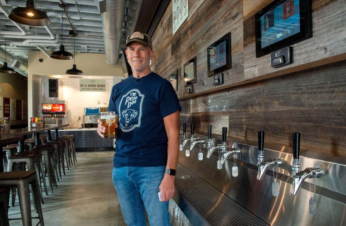 A “beer wall’ of 25 rotating taps beckons the DIY crowd to serve themselves at The Redd Dog U Pour It pub on Tacoma’s Sixth Avenue. Owner Lane Scelzi says the South Sound’s first self-serve taproom has been an instant hit but folks are still learning to tilt their glasses at a 45 degree angle to avoid too much foam. Cider, wine and kombucha are also available on tap.