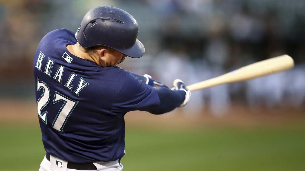 Seattle Mariners’ Ryon Healy swings for an RBI single off Oakland Athletics’ Frankie Montas during the first inning of a baseball game Thursday, Aug. 30, 2018, in Oakland, Calif. (AP Photo/Ben Margot)