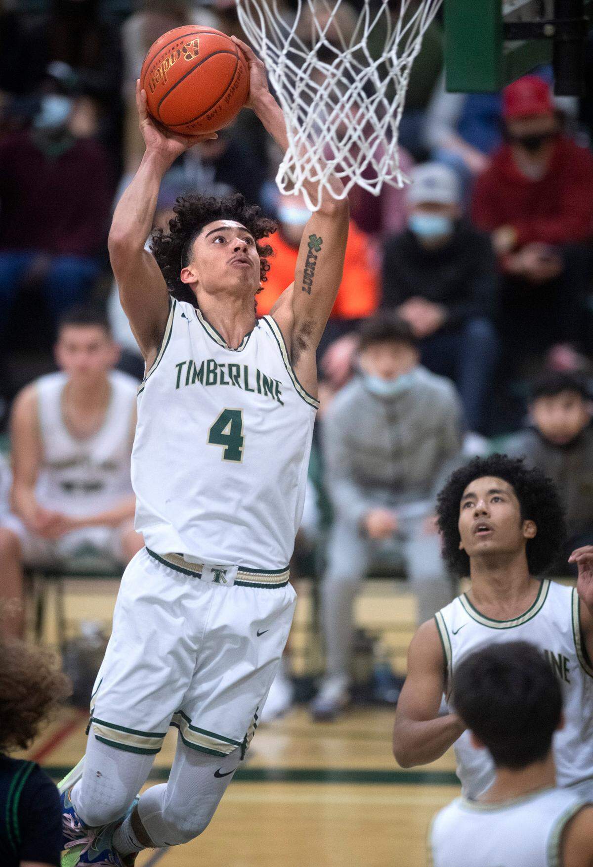 Timberline Brooklyn Hicks flies to the basket against the Todd Beamer Titans during Saturday night’s West Central III/Southwest bidistrict tournament boys basketball opening-round game at Timberline High School in Lacey, Washington, on Feb. 12, 2022. Timberline won the game, 70-40.