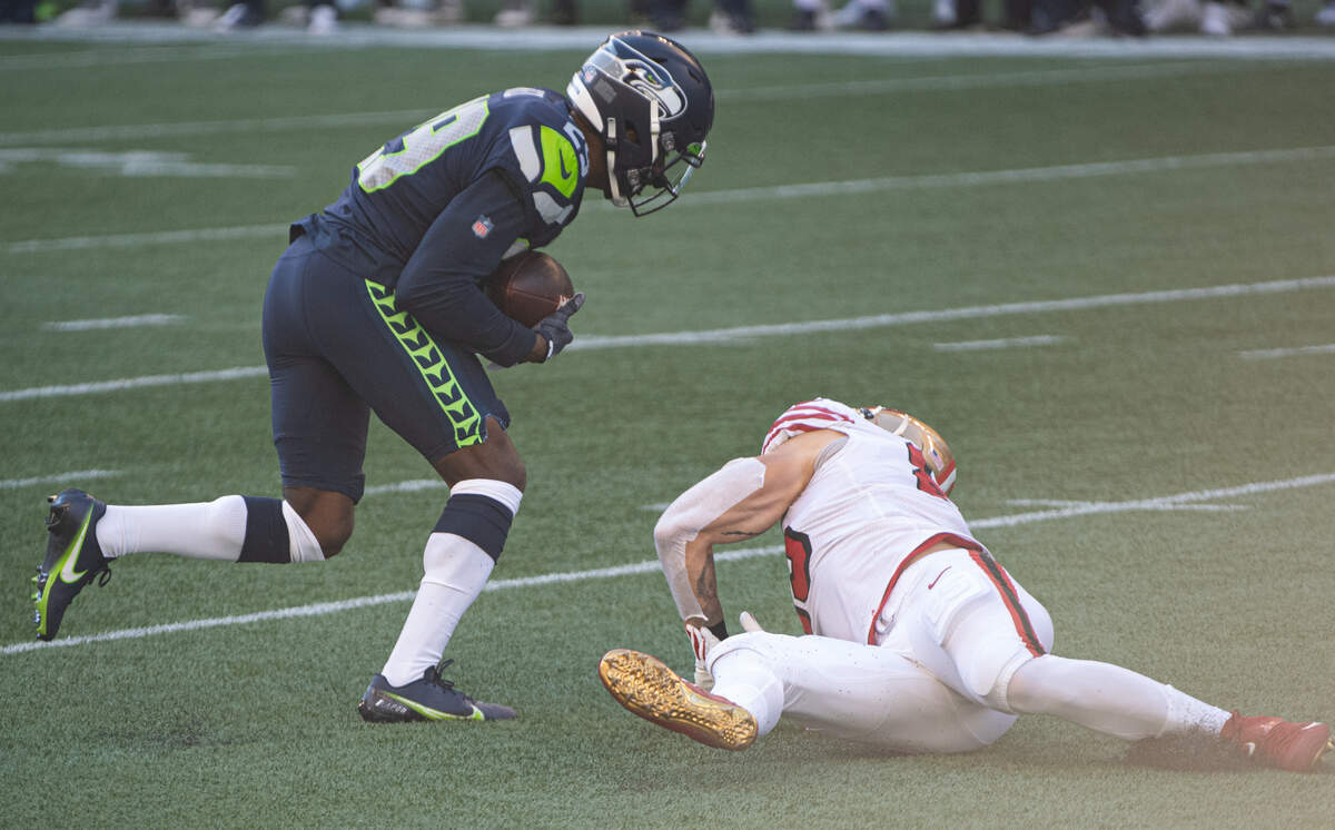 Seattle Seahawks defensive back D.J. Reed catches an interception during the first quarter. The Seattle Seahawks played the San Francisco 49ers in a NFL football game at CenturyLink Field in Seattle, Wash., on Sunday, Nov. 1, 2020.