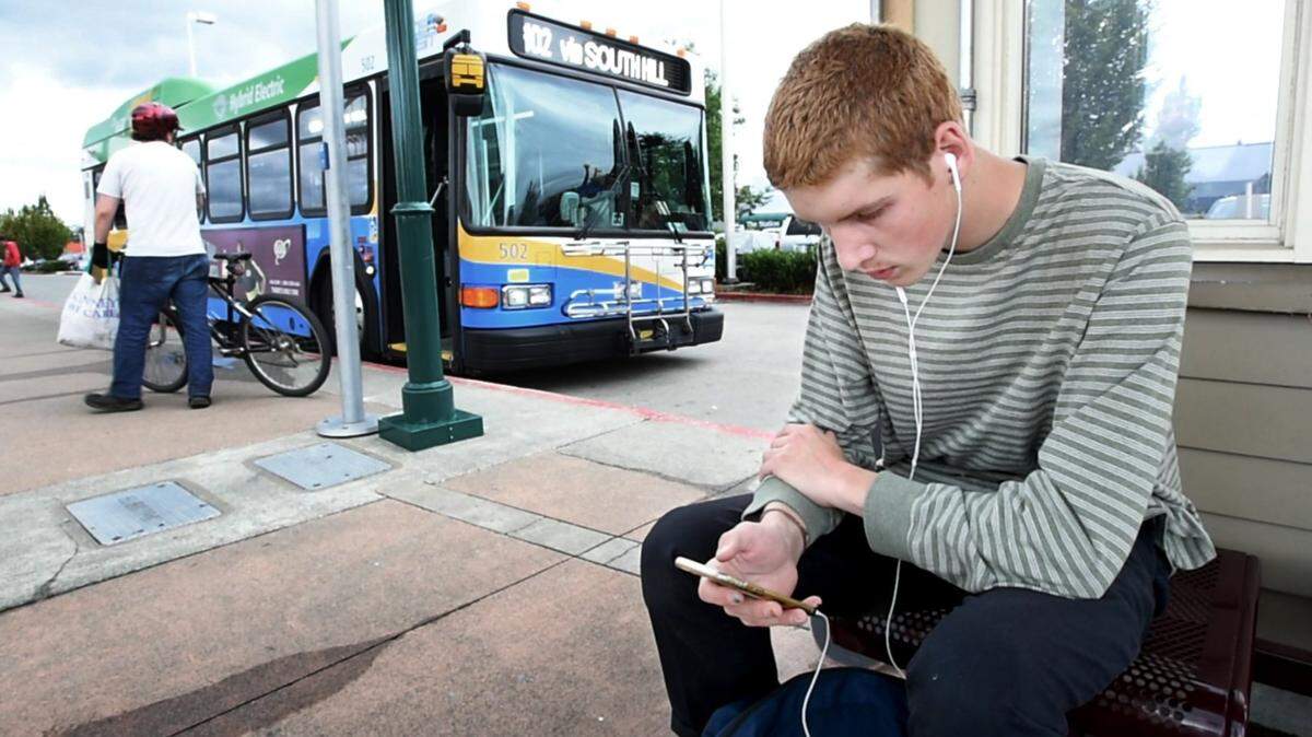 Joseph Faulk, 17, commutes on a Pierce Transit bus from Puyallup to the Tacoma School of the Arts every day. Photo taken in Puyallup on Friday, July 22, 2016.
