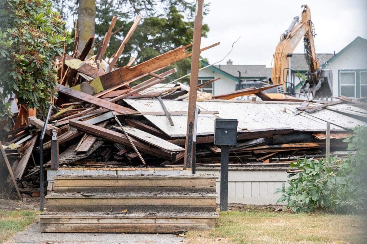 The front stairs of the Ryan House are visible as the 160-year-old home is demolished on Friday, July 25, 2025, in Sumner, Wash.