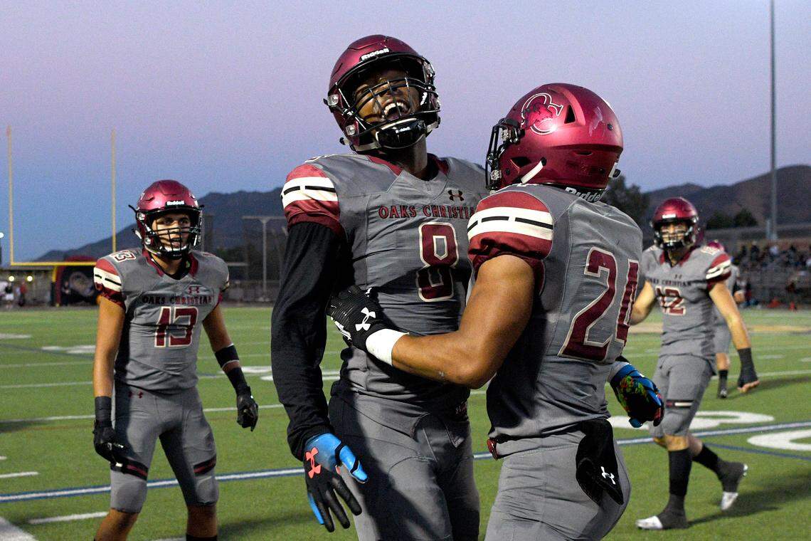 Oaks Christian’s Kayvon Thibodeaux (8) celebrates with running back Zach Charbonnet (24) after Charbonnet’s long touchdown against Alemany, Friday, Sept. 7, 2018, at Oaks Christian High School. (Photo by Michael Owen Baker, Contributing Photographer)