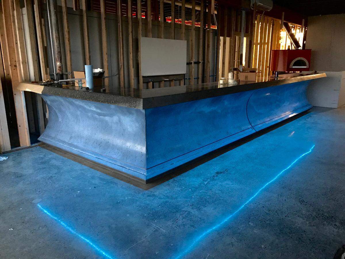 The custom concrete bar at Sig Brewing in Tacoma, pictured during construction in early 2020. Little did the team know then that they would wait more than a year to seat guests at the rail.